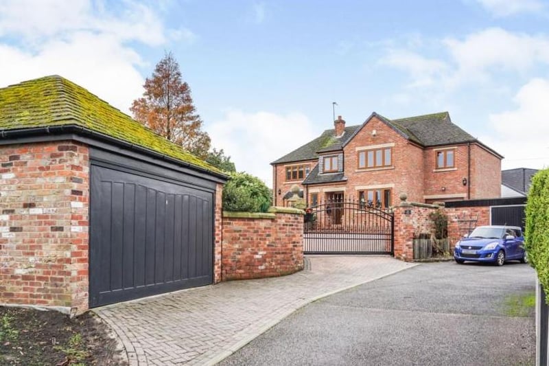 To the extreme front, beyond the walled garden, is a brick-built, double garage, with an electrically operated door.