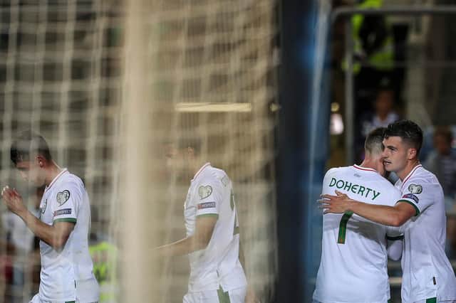 John Egan (right) celebrates scoring against Portugal - Carlos Costa/Getty