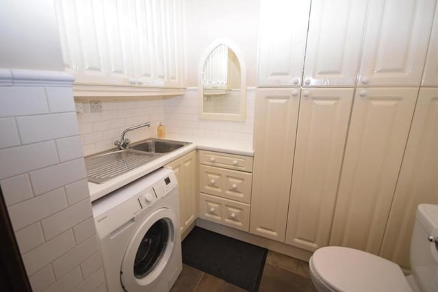 Just off the kitchen diner on the ground floor is this handy utility room, WC and cloakroom. It is fitted with wall and base units for storage, a stainless steel sink, plumbing for a washing machine and a fitted gas central heating boiler that has a warranty until 2029.