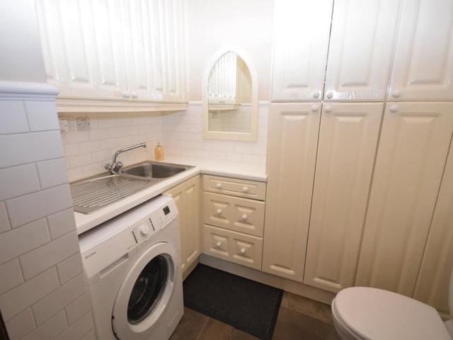 Just off the kitchen diner on the ground floor is this handy utility room, WC and cloakroom. It is fitted with wall and base units for storage, a stainless steel sink, plumbing for a washing machine and a fitted gas central heating boiler that has a warranty until 2029.