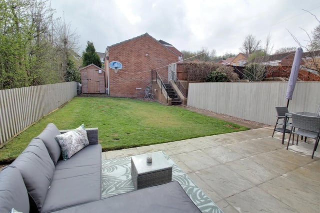 At the back and side of the property there is a generous lawned garden with patio and garden shed.