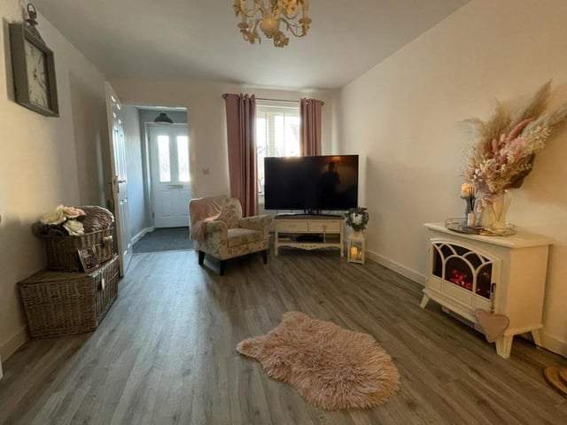 The beating heart of the Pleasley property is this large lounge. It includes a feature electric free-standing fire, while the uPVC double-glazed window faces the front of the house.
