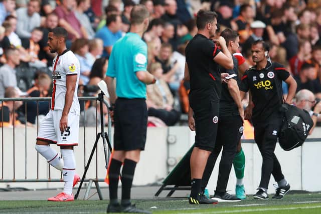 Max Lowe, the Sheffield United defender, limps off at Hull City: Simon Bellis / Sportimage