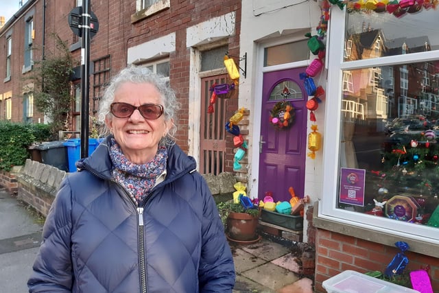 Residents have transformed Boyce Street, Walkley, Sheffield, into a giant Quality Street box to help S6 Foodbank. Pictured is resident Sue Benson