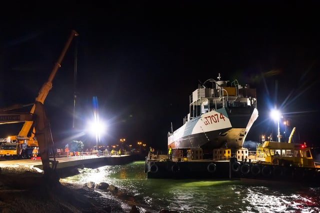 LCT 7074 is carried on the barge and sailed into position in Southsea in the early hours of the morning. Picture Credit: Keith Woodland