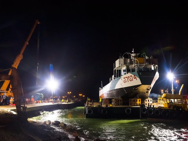 LCT 7074 is carried on the barge and sailed into position in Southsea in the early hours of the morning. Picture Credit: Keith Woodland