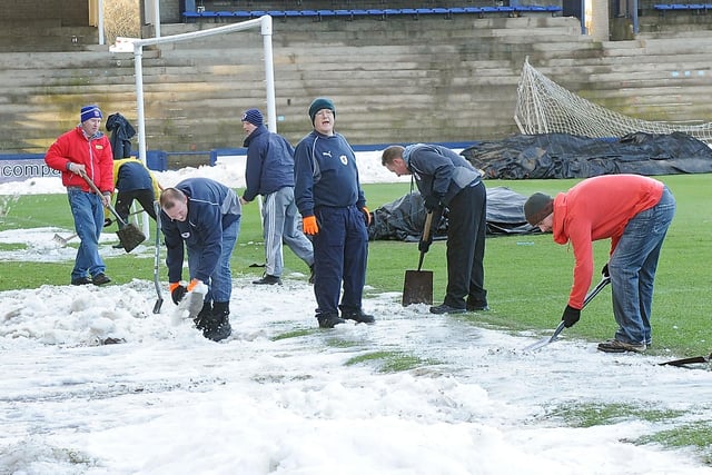 Volunteers clearing the hard-packed snow at Stark's Park, Kirkcaldy
