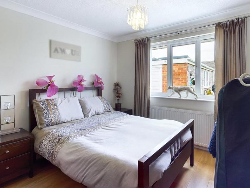 Bedroom - uPVC double glazed window to the rear elevation, ceiling coving, wood effect laminate flooring, radiator panel and power points.