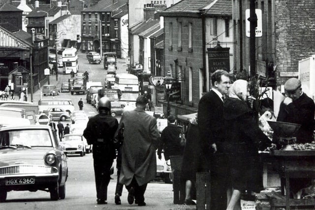 Dixon Lane was busy with cars, buses and market traders in August 1965