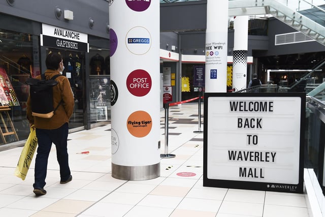 New floor markings and signs are on display in the shopping centre to remind customers to keep a safe distance at all times while shopping