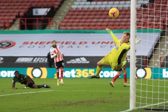 Tottenham Hotspur's Tanguy Ndombele sees his shot loop over Aaron Ramsdale and into the back of the net during his side's 3-1 defeat over Sheffield United at Bramall Lane yesterday. (Photo by MIKE EGERTON/POOL/AFP via Getty Images)