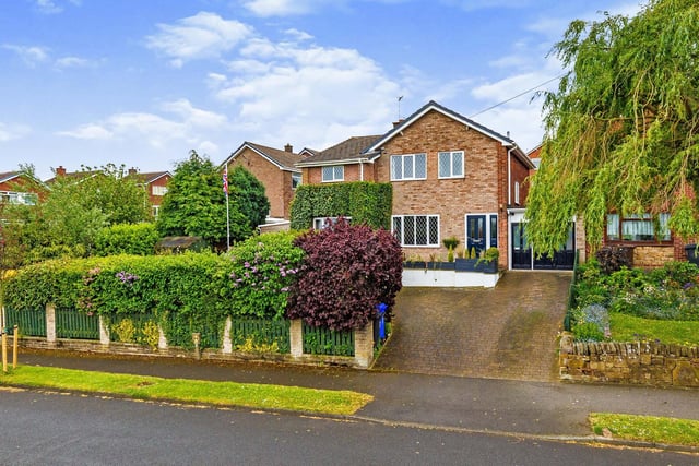 The detached family home has amazing views and its own bar. It is for sale in Sheffield at £360,000.