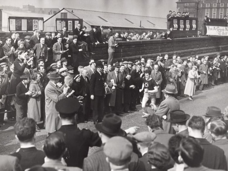 Ernest Kirkup of Rotherham finishes second at Furnival Road, Sheffield, in the 1956 Sheffield Telegraph Marathon