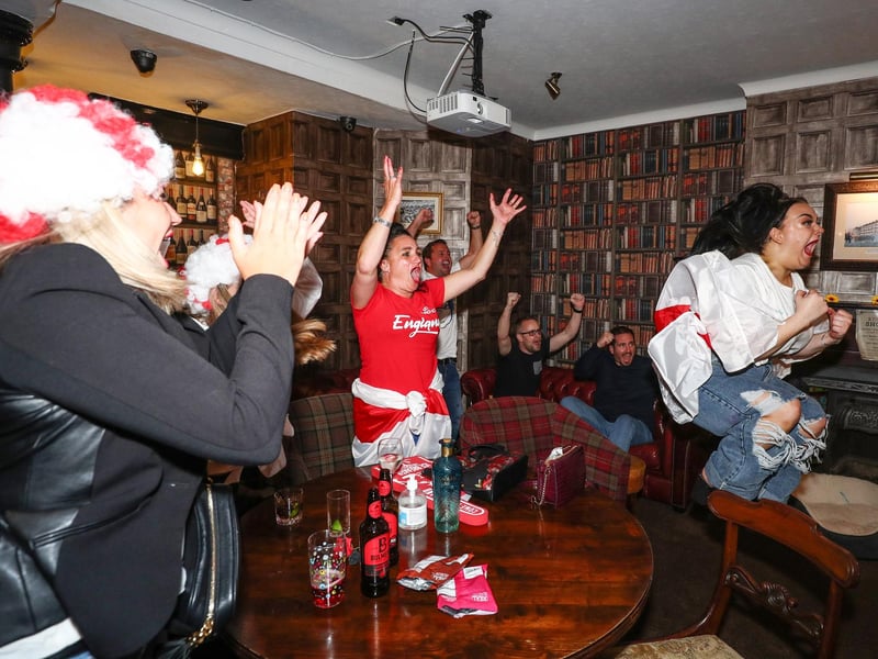 Fans pictured in The Kings pub celebrating as England score their second goal. Picture: Stuart Martin (220421-7042)