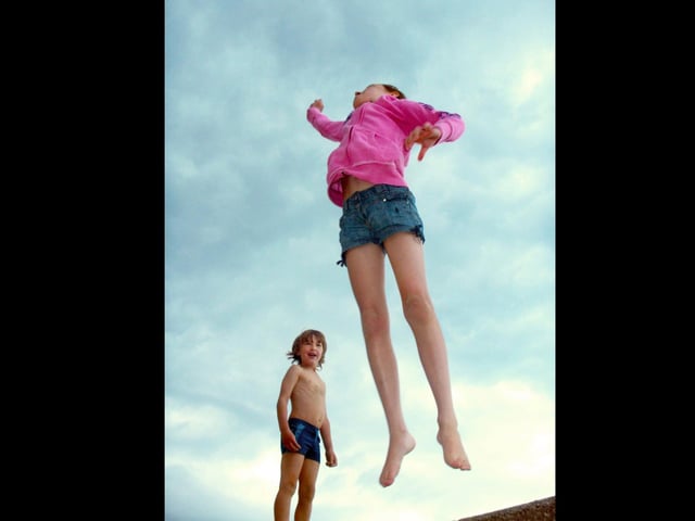 Mia and Sam playing a jumping competition in their own makebelieve Olympic event on Saturday afternoon back in 2012 at Emsworth.