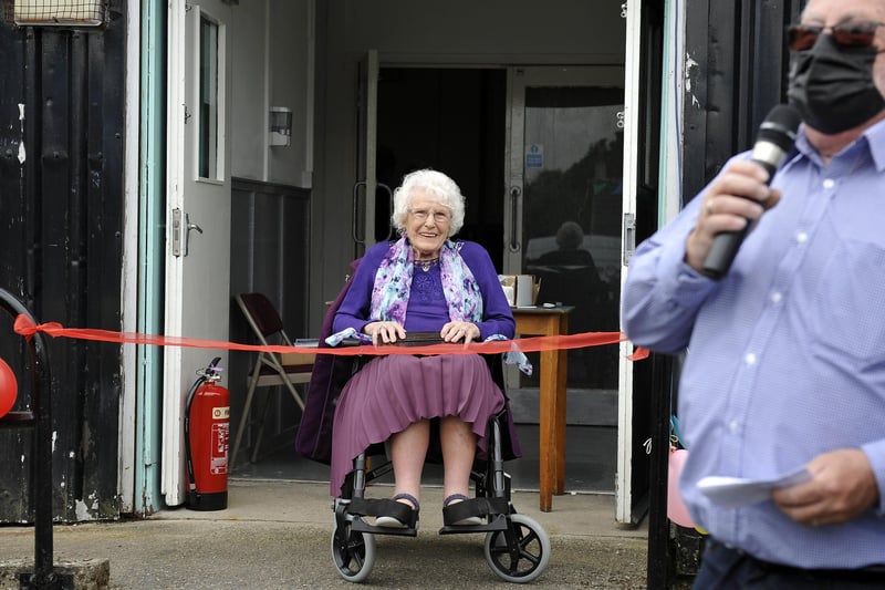 California's oldest resident, 100-year-old Marion Laurie, officially opens the village's new community hub