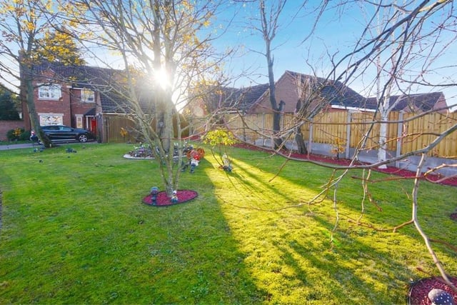 This is the final image of our gallery, showing the lawn, mature trees and shrubs towards the front of the Springwood Drive property. The big question now is: are you tempted to give the Express Estate Agency a call and arrange a viewing?