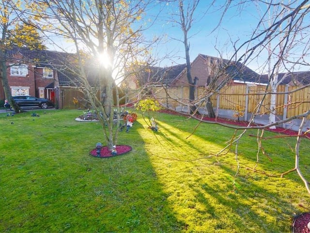 This is the final image of our gallery, showing the lawn, mature trees and shrubs towards the front of the Springwood Drive property. The big question now is: are you tempted to give the Express Estate Agency a call and arrange a viewing?