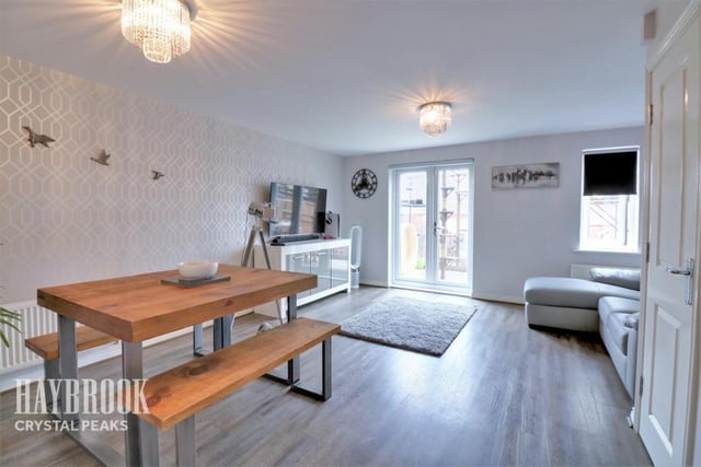This spacious living/dining room has been beautifully finished with a modern feel. It's bright and airy and has direct access to the tremendous back garden.