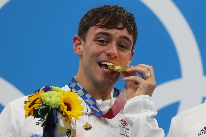 TOKYO, JAPAN - JULY 26: Tom Daley of Team Great Britain poses with the gold medal during the medal presentation for the Men's Synchronised 10m Platform Final