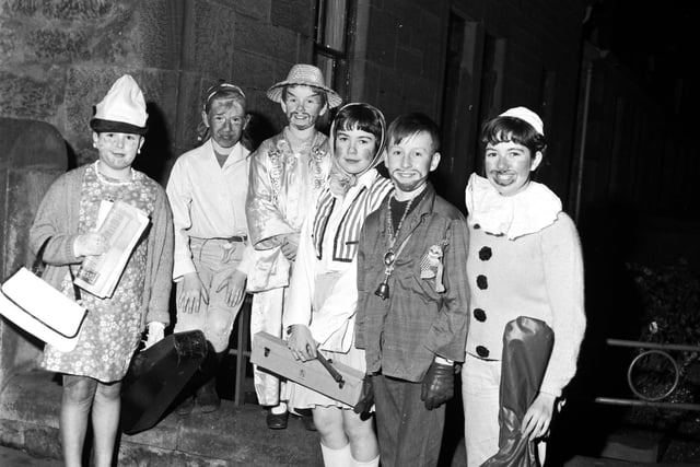 Young guisers dressed as Chinaman, Hippy, Clown etc with their musical instruments in Falkirk, November 1967