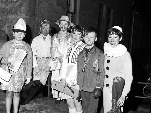 Young guisers dressed as Chinaman, Hippy, Clown etc with their musical instruments in Falkirk, November 1967
