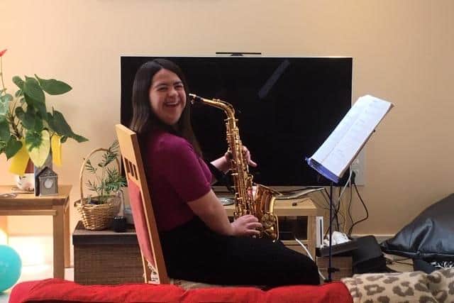 Kirsty playing the saxophone.