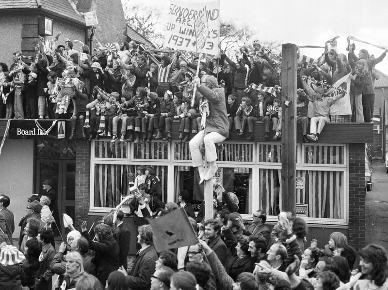 These fans packed on to the roof of the Board Inn, East Herrington, and even on to lampposts, to get a view of the 1973 Sunderland homecoming parade.