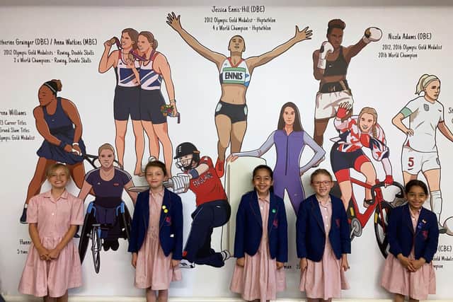 Some of the Birkdale Prep School girls in front of the mural