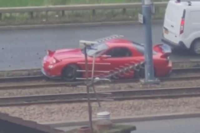 A Mazda RX-7 ended up grounded after it was mistakenly driven along the tram tracks on Netherthorpe Road in Sheffield today