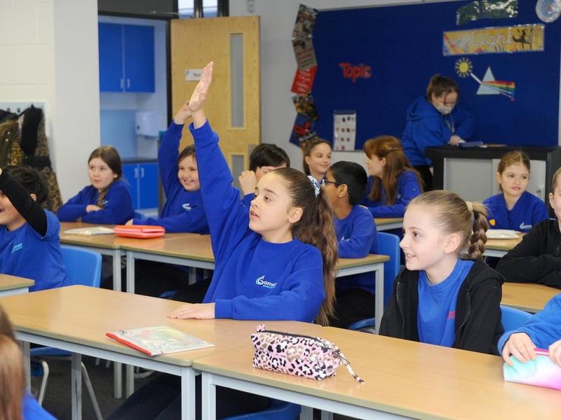 Darcey Crascall raises her hand during a lesson