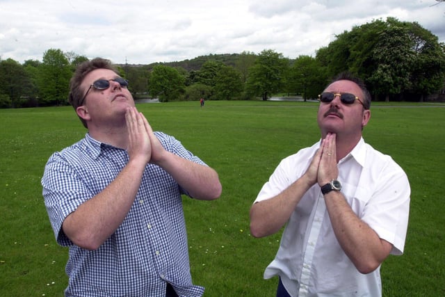 Organisers of the Mayfest, Scott Barton, left and Kevin Cheetham pray for no rain in Hillsborough Park back in 2001