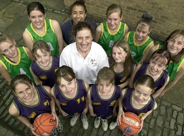 Ann Jamieson (centre) of the Sheffield Hatters and head of PE at Yewlands School, with the school's U14 basketball team that are off to Scotland to play in a tournament on June 7, 2000