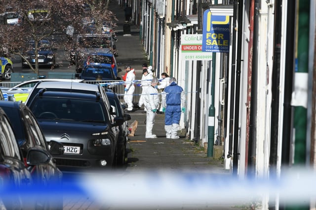 Scenes of crime officers pictured at the scene on Saturday afternoon.