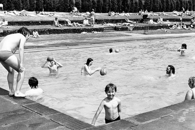 Swimmers and sun bathers at Longley Swimming Pool, Sheffield, which was reopened to the public on June 12, 1975