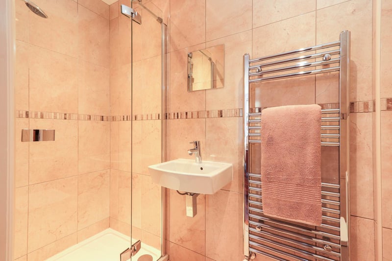 This is one of two fully tiled en-suite shower rooms.