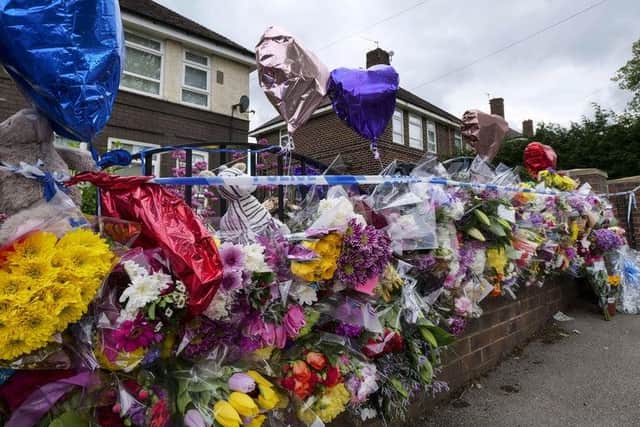 Flowers left outside the house in Shiregreen where Blake and Tristan Barrass were killed by their parents