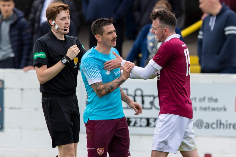Hearts' Jamie Walker (left) clashes with Linlithgow's Dean Cairns