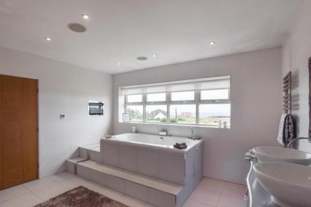 The master bedroom benefits from a fantastic en-suite with step up large jacuzzi bath along with his and hers sinks.