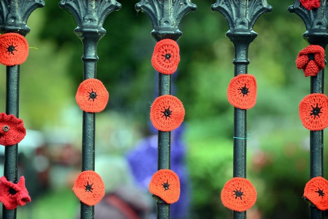 Residents have produced thousands of poppies to line the fence