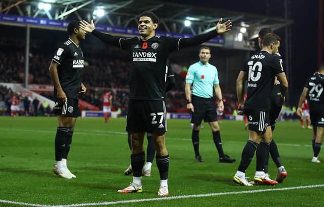 Morgan Gibbs-White celebrates his goal in front of the Sheffield United fans at Nottingham Forest: Simon Bellis / Sportimage