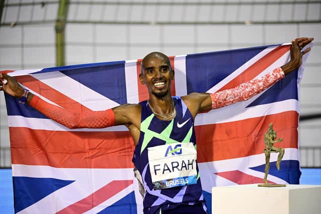 (FILES) In this file photo taken on September 5, 2020 Britain's Mo Farah celebrates after victory and a world record in the men's one hour event at The Diamond League AG Memorial Van Damme athletics meeting at The King Baudouin Stadium in Brussels. - Olympic great Mo Farah was illegally trafficked to Britain at the age of nine from Djibouti and forced to work as a child servant, he has revealed, saying his real name is Hussein Abdi Kahin. (Photo by MARTIN BUREAU / AFP) (Photo by MARTIN BUREAU/AFP via Getty Images)