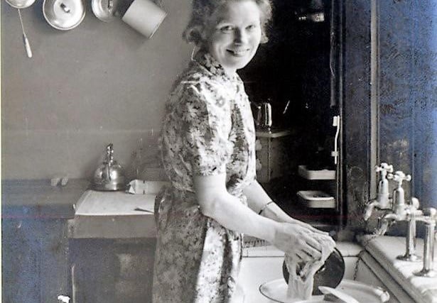 Washing the pots in a Sheffield home in the 1940s