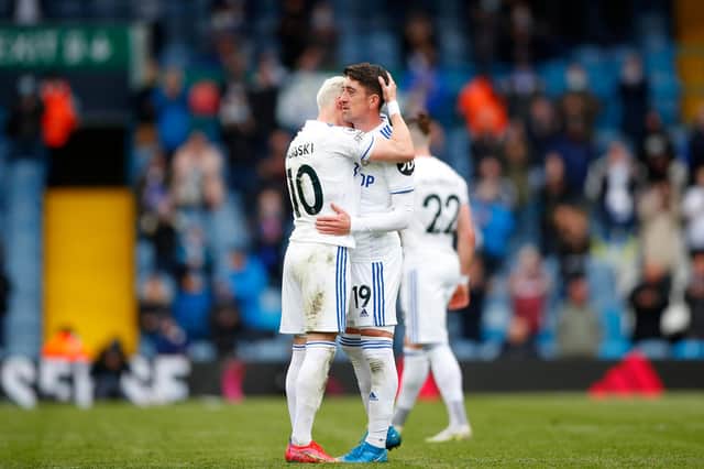 LEEDS, ENGLAND - MAY 23: Pablo Hernandez of Leeds United hugs Ezgjan Alioski during his final game as he leaves the pitch during the Premier League match between Leeds United and West Bromwich Albion at Elland Road on May 23, 2021 in Leeds, England. A limited number of fans will be allowed into Premier League stadiums as Coronavirus restrictions begin to ease in the UK. (Photo by Lynne Cameron - Pool/Getty Images)