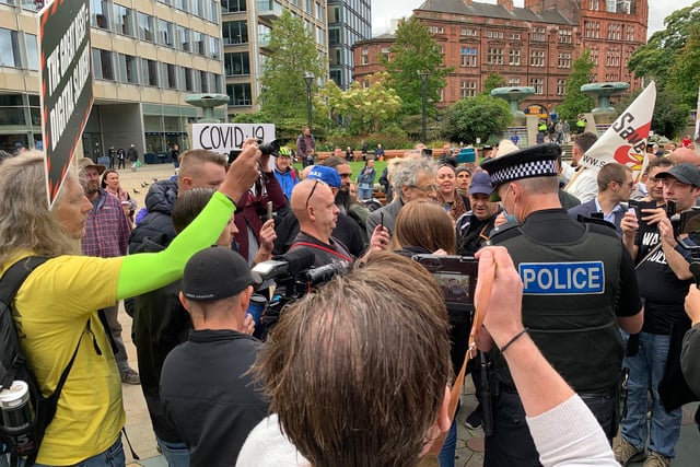 Crowds jeered at the police as they talked with Corbyn