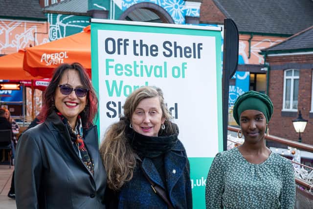 Surriya Falconer, Professor Vanessa Toulmin and Sheffield poet laureate Warda Yassin at the launch of Warda's poem to Sheffield that has gone on display in Orchard Square as part of the 30th anniversary celebrations of city words festival Off the Shelf