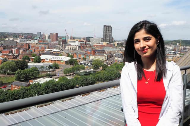 Lodmilla Khalil is pictured on the seventh floor balcony of Sheffield College's City Campus. She is now studying pharmacy after arriving in Sheffield with no English.