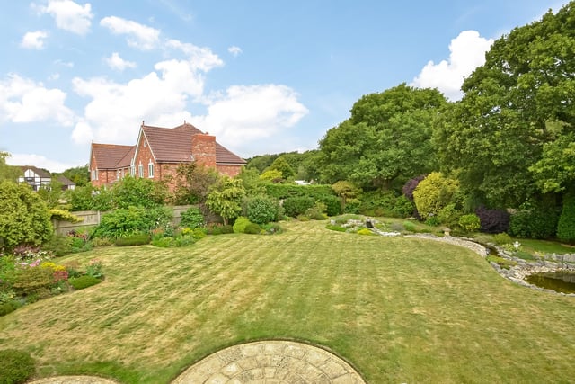 The house comes with a manicured Gardens extending 0.53 of an acre - and the garden backs onto woodland.