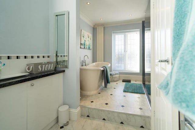 The family bathroom on the first floor of the house has a free standing roll top bath with mixer tap, walk in double shower cubicle with spider rainfall style shower head and a double glazed window opening to a Juliet balcony.

Photo: Rightmove/Michael Hodgson