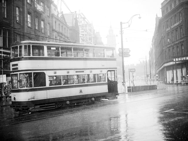 One of the remaining trams makes it's last journey along the tracks in High Street, Sheffield, October 8, 1960